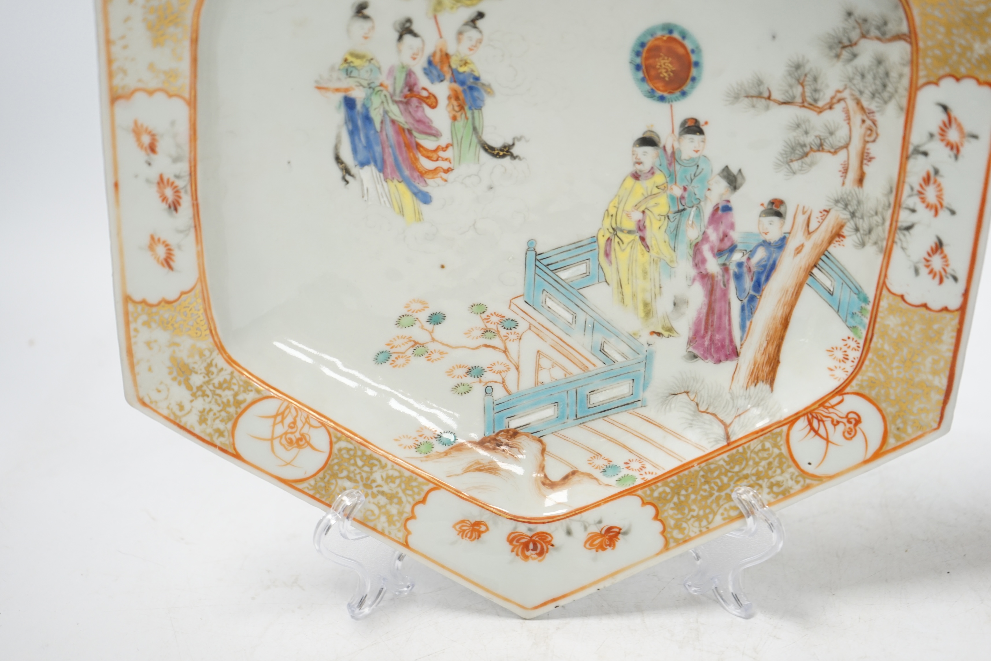 An 18th century Chinese hexagonal dish, painted with figures on a terrace, 28cm wide. Condition - fair, feint star crack to base